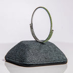 August peridot birthstone bangle in silver featuring olive-green crystals on clasp-free memory wire