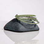 August peridot birthstone bangles in silver with green crystals stacked showing flexible design