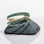 December blue zircon birthstone bangles in gold with blue crystals stacked to show one-size-fits-most design