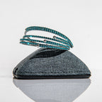 December blue zircon birthstone bangles in silver with violet-blue crystals stacked showing flexible design