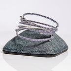 February amethyst birthstone bangle in gold showing purple crystals on flexible memory wire construction