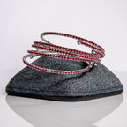 July ruby birthstone bangles in silver with fiery red crystals stacked showing flexible memory wire