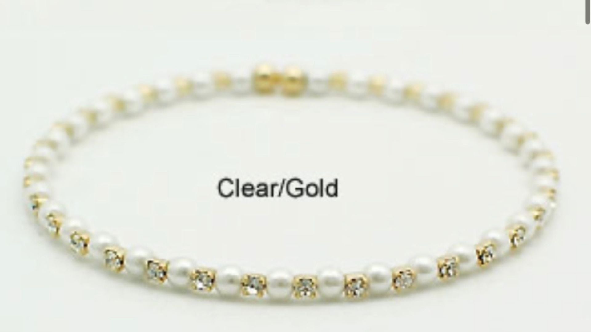 June pearl birthstone bangle in gold showing elegant pearl crystals and flexible memory wire detail