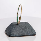 May emerald birthstone bangle in gold showing lush emerald crystals on flexible memory wire