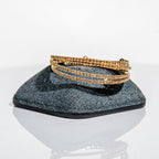 November topaz birthstone bangles in gold with golden crystals stacked to demonstrate flexible fit
