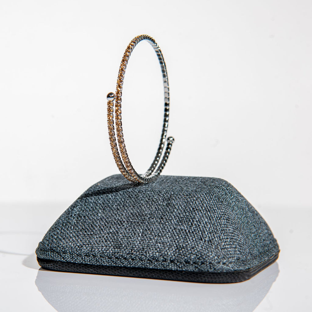  November topaz birthstone bangle in silver featuring golden amber crystals on clasp-free design
