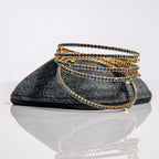 September sapphire birthstone bangles in gold with blue crystals stacked to show flexible memory wire